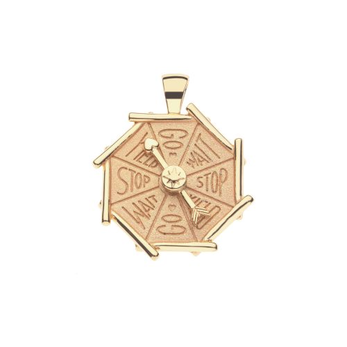 Gold coin pendant with bamboo inspired border and functioning spinner featuring the words 