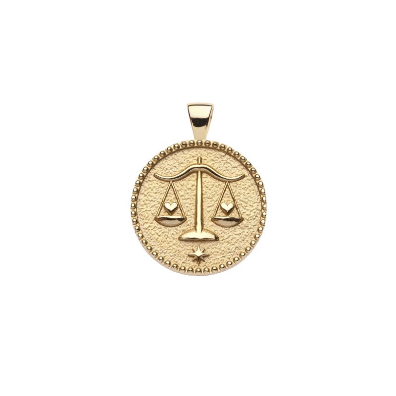 Gold small Libra coin pendant features balanced scales holding hearts