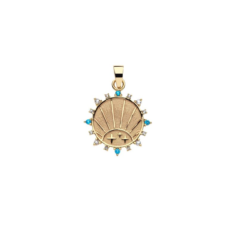 Gold coin pendant with rising sun design and aquamarine, sky blue topaz, and white topaz stones on border